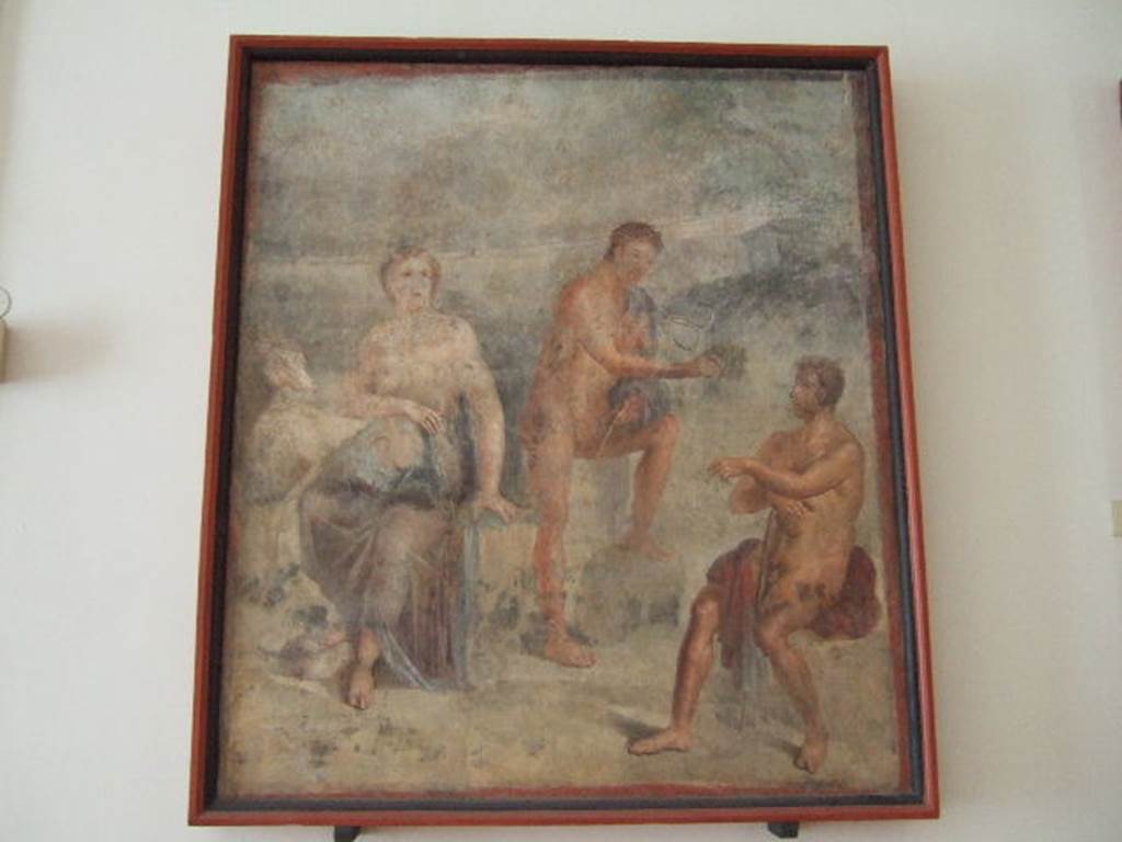 VIII.7.28 Pompeii. Found in the centre of the north wall of the Ekklesiasterion.
Wall painting of Io shown with horns guarded by Argus to whom Hermes is showing his syrinx.
Now in Naples Archaeological Museum. Inventory number 9548.