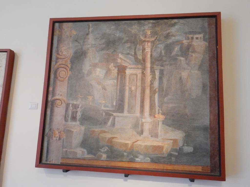 VIII.7.28 Pompeii. June 2019. Rocky landscape with little temple, sacred door and king-fisher.
Found on the right side of the north wall. Photo courtesy of Buzz Ferebee.