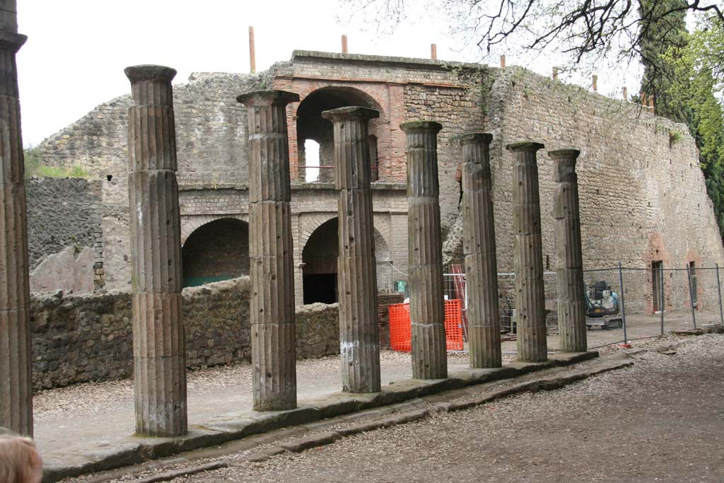 VIII.7.30 Pompeii. April 2010. Portico, looking south at east side, with west side of Large Theatre behind columns.
Photo courtesy of Klaus Heese.