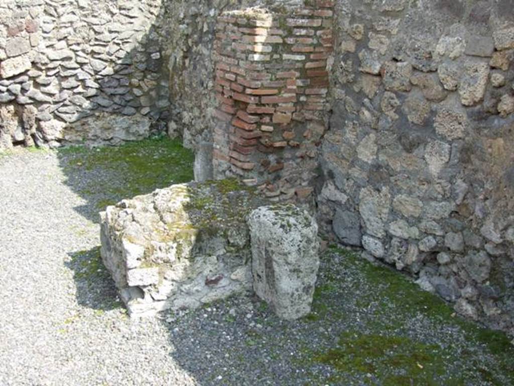 IX.1.2 Pompeii. March 2009. South wall, with base for stairs to upper floor, and Latrine underneath.