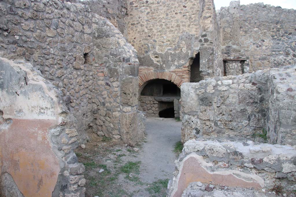 IX.1.3 Pompeii. September 2017. Looking east across rooms towards oven in linked bakery at IX.1.33.
Photo courtesy of Klaus Heese.