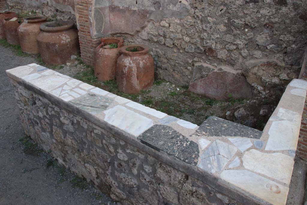 IX.1.3 Pompeii. September 2017. Looking south to rear of marble counter. Photo courtesy of Klaus Heese.