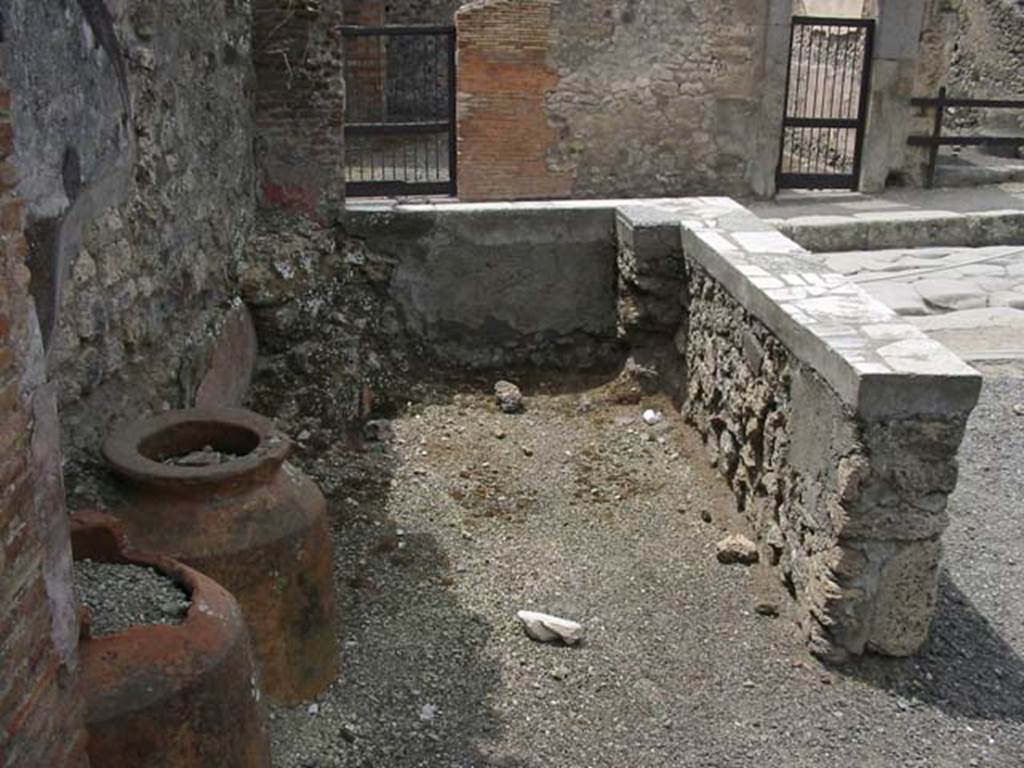 IX.1.3 Pompeii. May 2003. Looking west from rear of counter. Photo courtesy of Nicolas Monteix.