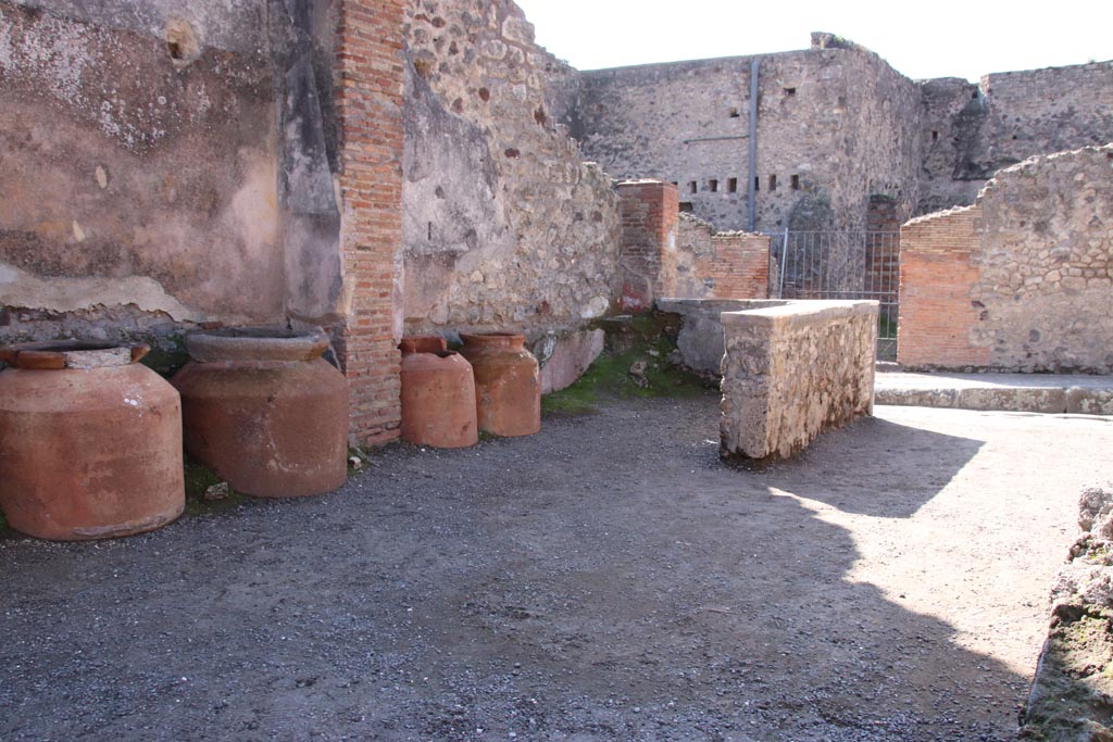 IX.1.3 Pompeii. October 2022.
Looking south-west towards rear of counter, and entrance onto Via Stabiana. Photo courtesy of Klaus Heese