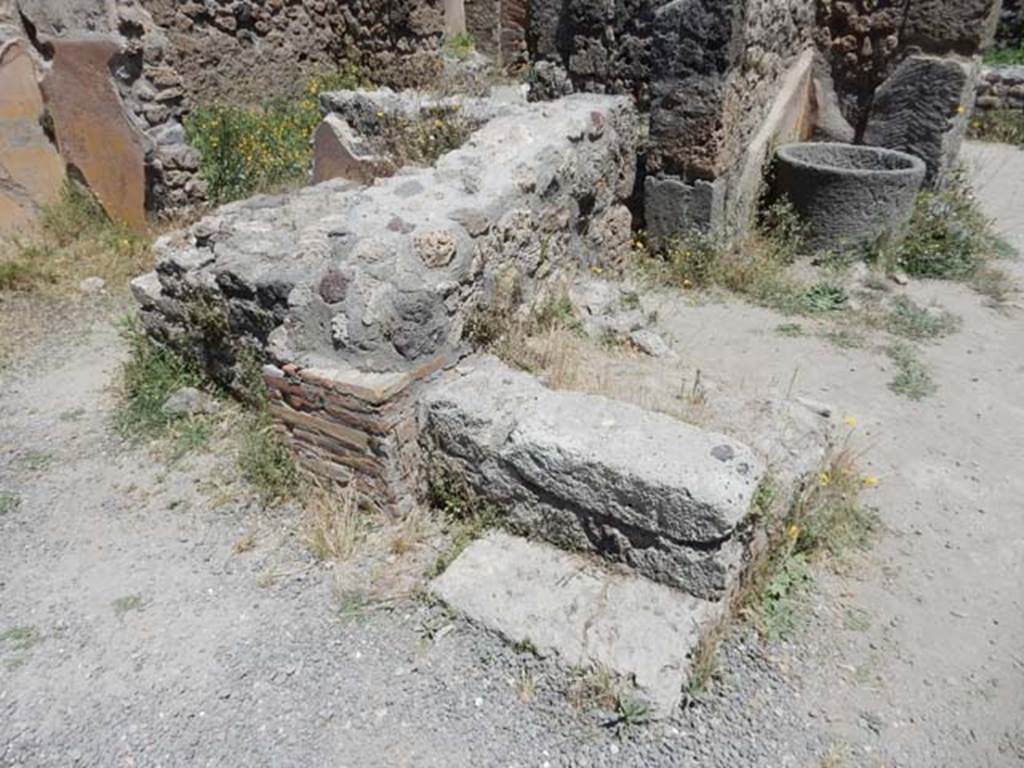 IX.1.3 Pompeii. May 2017. Looking towards lower stone step of stairs to upper floor, on east side of doorway to cubiculum, on left. Photo courtesy of Buzz Ferebee.