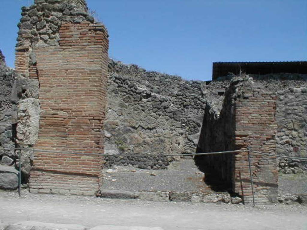 IX.1.9 Pompeii. May 2005. Entrance on Via Stabiana, looking east.
According to Della Corte, found on the pilaster between IX.1.9 or IX.1.10, on the right, was a painted recommendation, 
Faustinum aed(ilem)
Fabritius  rog(at)    [CIL IV 958 ]
He said he could not know which of the two shops this Pompeian was established in.
See Della Corte, M., 1965.  Case ed Abitanti di Pompei. Napoli: Fausto Fiorentino. (p.210) (see also IX.1.10) 
A bronze cooking pot without a handle, 36cm high, was found in this shop.
See Gallo, A (2001). Pompei, L�Insula I della Regione IX, Settore Occidentale (p.61), in SAP book no. 1 (L�Erma di Bretschneider)
