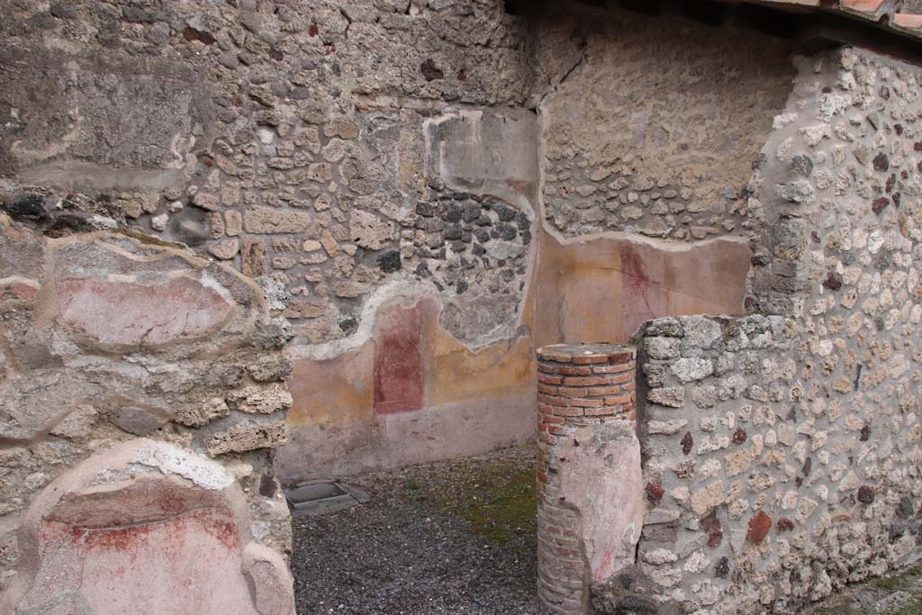 IX.1.12 Pompeii. October 2020.
Looking south-east towards decorated walls in cubiculum in north-east corner of peristyle. Photo courtesy of Klaus Heese.