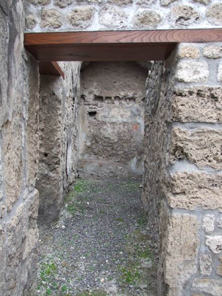 IX.1.12 Pompeii. December 2007. Corridor on north-west side of peristyle next to stone steps.