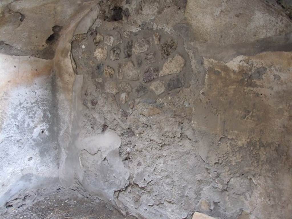 IX.1.12 Pompeii. December 2007. East wall and arch under the stairs in room at end of corridor on north-west side of peristyle.