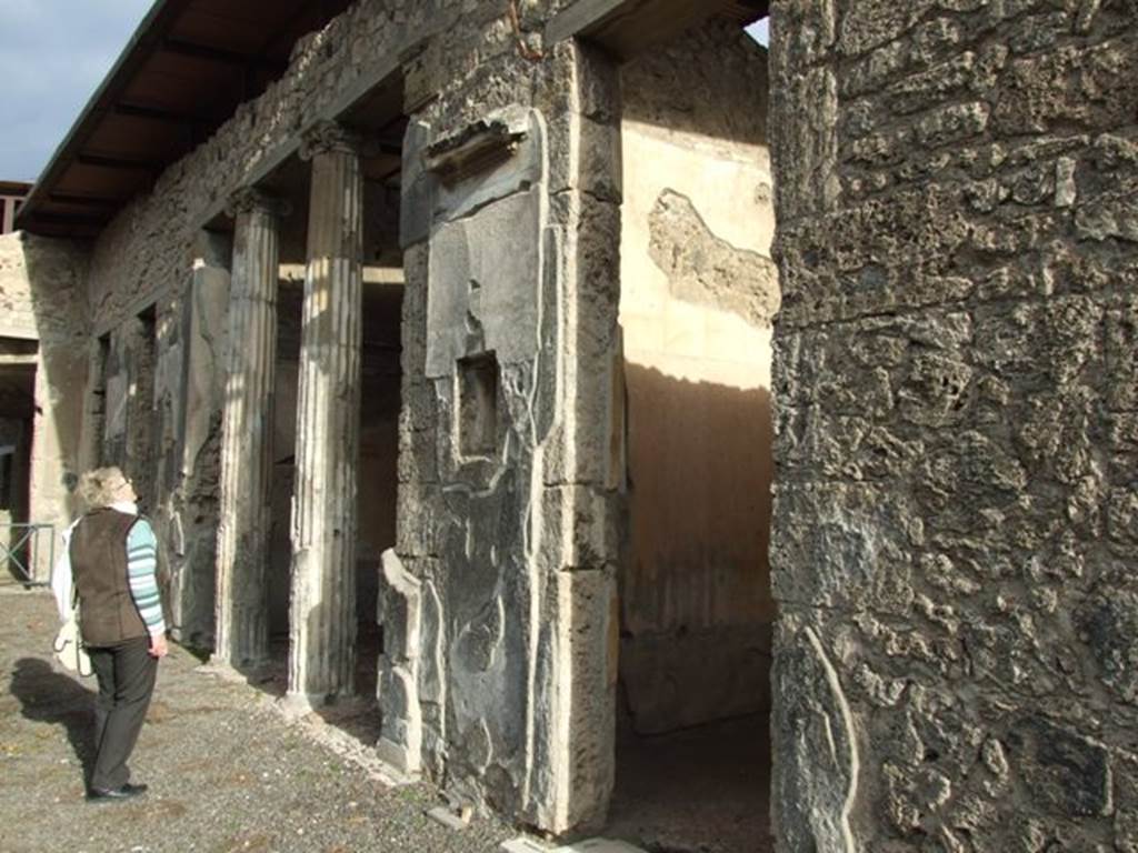 IX.1.20 Pompeii. December 2007. Room 2. Atrium. East side showing doorways to Room 5 (with window) and Room 6 Ala with columns.