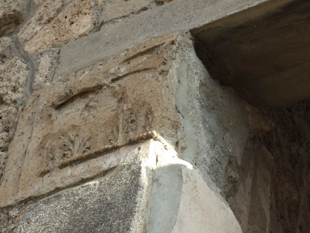 IX.1.20 Pompeii. December 2007. Room 2. Atrium. East Side. Figured capital from north eastern corner consisting of a bust above a band of acanthus (damaged).