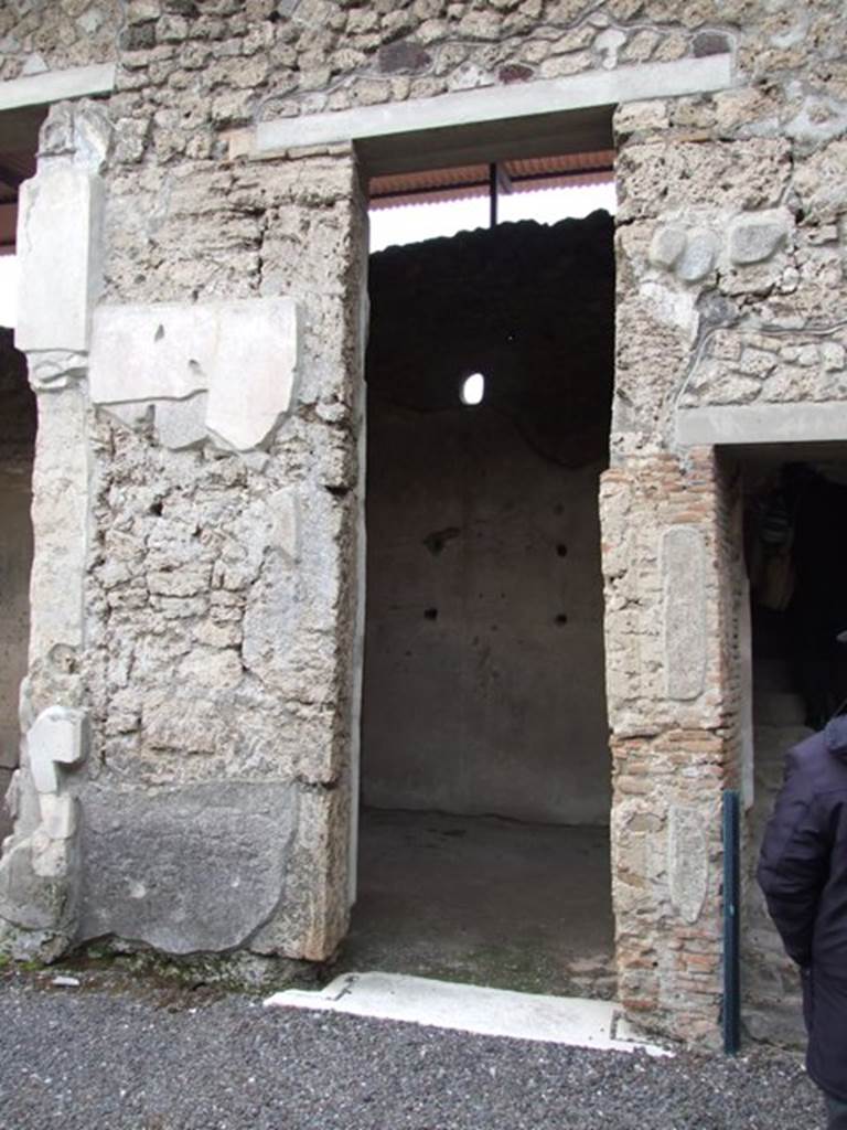 IX.1.20 Pompeii. December 2007. Doorway to Room 17. On the rear wall can be seen the traces of shelving.