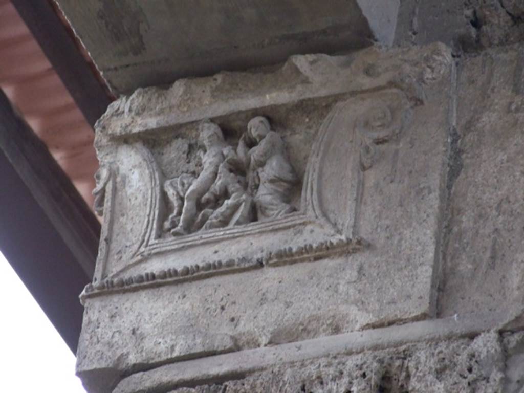 IX.1.20 Pompeii. December 2007. Room 2. Atrium west side. Figured capital from south western corner consisting of a full figure relief of satyrs and bacchantes.