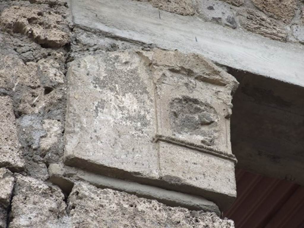 IX.1.20 Pompeii. December 2007. Room 2, west side of atrium.
Damaged front face of capital from south-western corner.