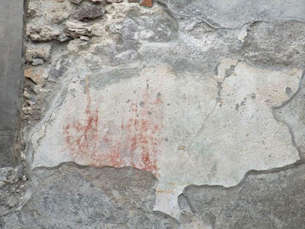 IX.1.22 Pompeii. December 2007. Room 14, remains of painted decoration on west side of first peristyle.