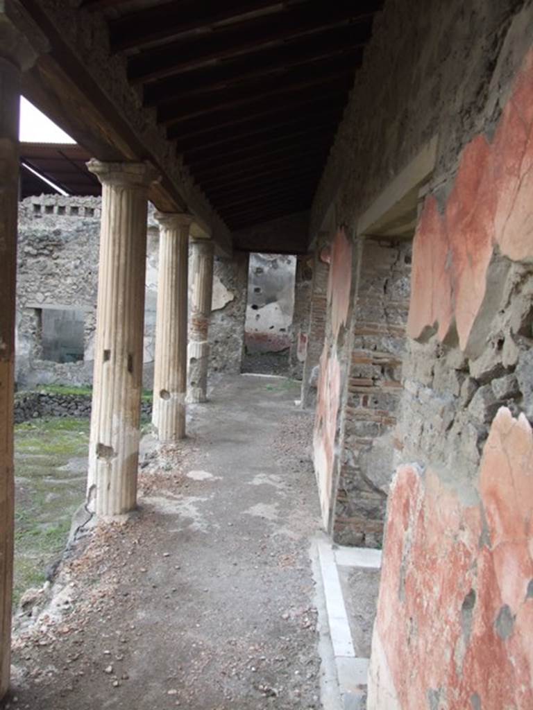 IX.1.22 House of M. Epidi Sabini. December 2007. Room 14. First peristyle looking west along north side in front of doorway to room 19.