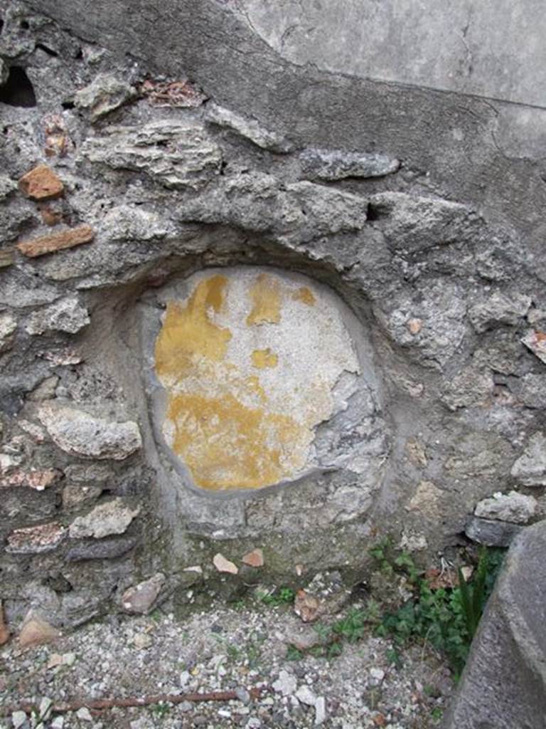 IX.1.22 House of M. Epidi Sabini. December 2007. Room 24. Second Peristyle. Painted yellow plaster in recess in south east corner of peristyle.
