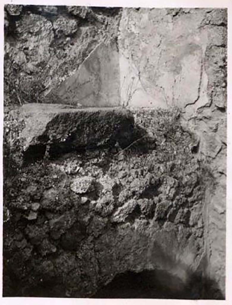 IX.1.22 Pompeii. Pre-1943. Upper room above arch with embedded puteal in floor. Photo by Tatiana Warscher.
Warscher described it as “a piece of square tufa with a wide round opening”.
This opening would allow water to be drawn up through the cistern mouth on the lower floor, via the opening above it directly to the upper floor.
See Warscher, T. Codex Topographicus Pompeianus, IX.1. (1943), Swedish Institute, Rome. (no.159), p. 275.
