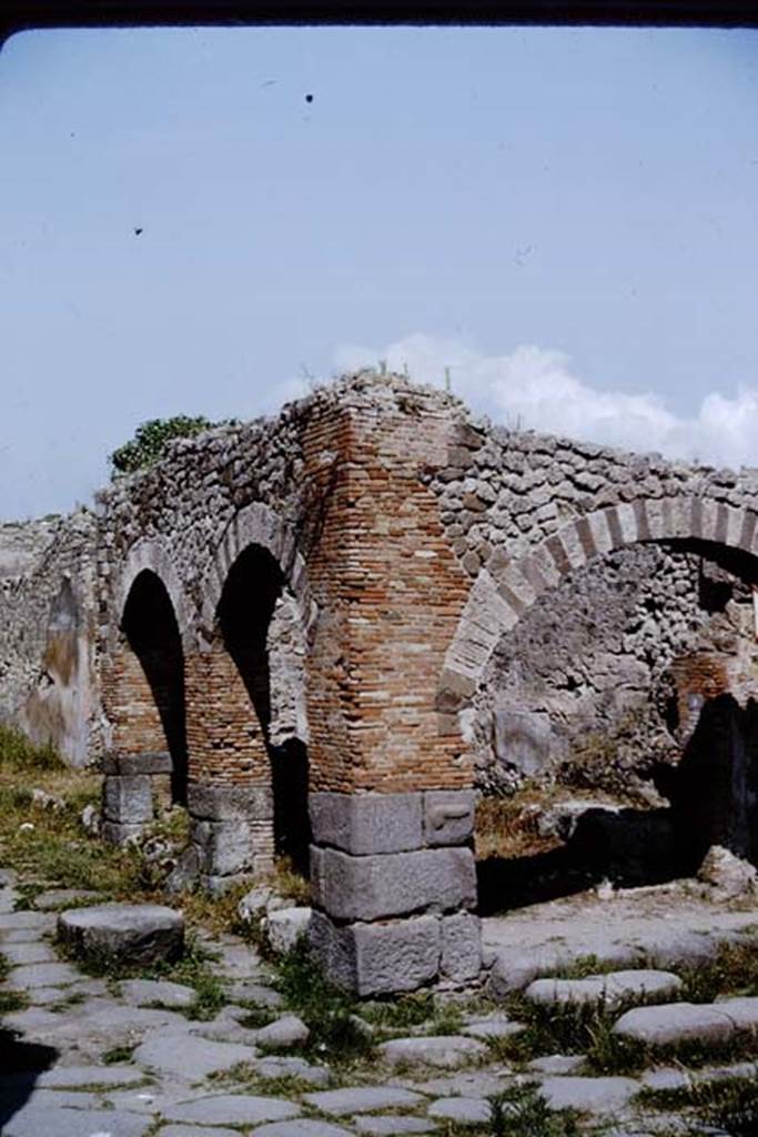 IX.2.1 Pompeii. 1964. Looking towards corner arcade pillar, with carved phallus on lavastone. Photo by Stanley A. Jashemski.
Source: The Wilhelmina and Stanley A. Jashemski archive in the University of Maryland Library, Special Collections (See collection page) and made available under the Creative Commons Attribution-Non Commercial License v.4. See Licence and use details.
J64f1311