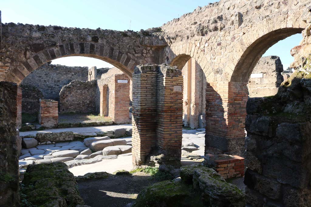 IX.2.1 Pompeii. December 2018.
Looking north-west from interior towards Via Stabiana, on left, junction with unnamed vicolo (Via degli Augustali), on right.
Photo courtesy of Aude Durand.