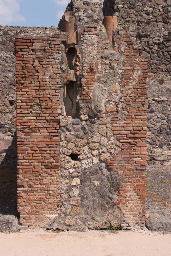 IX.2.3 Pompeii, on right. September 2021.
Looking east to pilaster with downpipes between IX.2.2, on left, and IX.2.3, on right.
Photo courtesy of Klaus Heese.