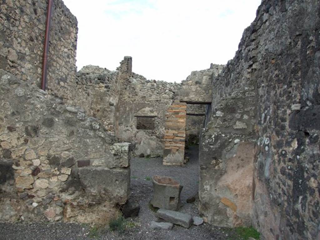 IX.2.4 Pompeii. December 2007. East wall of shop, and doorway to atrium, with more fragments of mills.