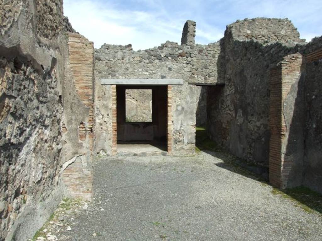 IX.2.5 Pompeii. March 2009. Looking east across shop towards Triclinium and corridor to rear.