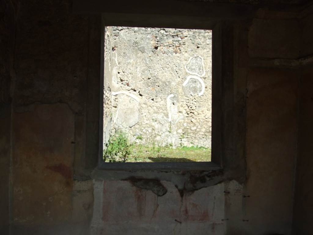IX.2.5 Pompeii. March 2009. Triclinium, window in east wall, overlooking garden. In the middle of the yellow side panels were medallions, but it is no longer possible to determine their identity. Sogliano identified one of Paris with a cupid, and the other of Helen, but that was nearly vanished. He did not give their location in the room. A bust of Paris wearing a green hat, with cupid on his right shoulder (p.105, no.558), A bust of Helen, turning to the left, in response to no.558, faded and vanishing (p.108, no.567).
See Sogliano, A., 1879. Le pitture murali campane scoverte negli anni 1867-79. Napoli: Giannini.
According to PPP, there would have been medallions in all of the side panels of the walls, mostly undistinguishable when found.
See Bragantini, de Vos, Badoni, 1986. Pitture e Pavimenti di Pompei, Parte 3. Rome: ICCD. (p.406).
According to Fiorelli, A bust of Paris was also found here, with crook on one shoulder and a cupid on the other caressing his chin; and also a veiled Helen. Another two busts similar to the previous were seen, of a crowned poet and of a writer, both enclosed in a medallion, as well as four landscapes of countryside or marine.
See Fiorelli, G, (1875). Descrizione di Pompeii (p.379).
See Pappalardo, U., 2001. La Descrizione di Pompei per Giuseppe Fiorelli (1875). Napoli: Massa Editore. (p.141).