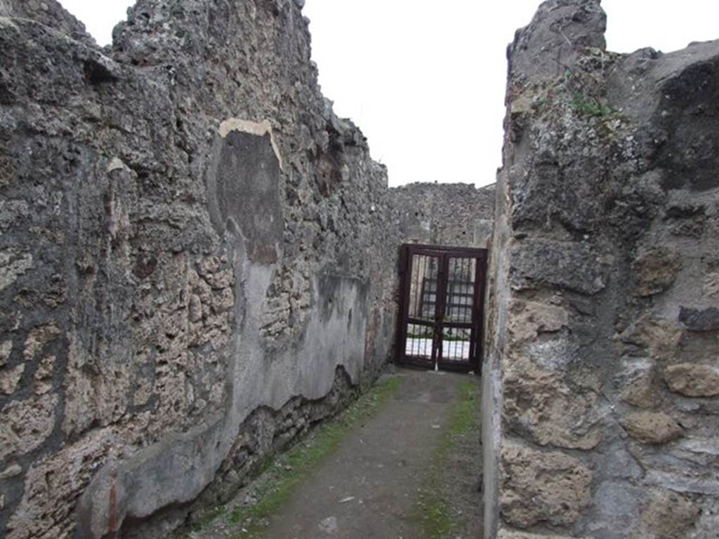 IX.2.10 Pompeii. December 2007. Entrance corridor looking west to entrance. On the right would be the doorway to a triclinium, not photographed. According to Sogliano, the paintings found in this room, the triclinium on west side of peristyle, would be -
Psyche with plate in left hand. (no. 388 but nearly vanished). Psyche with cornucopia or similar, (no.389.), p.67.
Female figure, on a yellow background, with dark red mantle, in her right hand a plate and her left hand holding up a garland? (no.834), p.160.
See Sogliano, A., 1879. Le pitture murali campane scoverte negli anni 1867-79. Napoli: Giannini. (p.67 and 160)
According to Helbig, Apollo (H216), Endymion (H959), and Narcissus (H1360) were found here. See Helbig, W., 1868. Wandgemälde der vom Vesuv verschütteten Städte Campaniens. Leipzig: Breitkopf und Härtel.