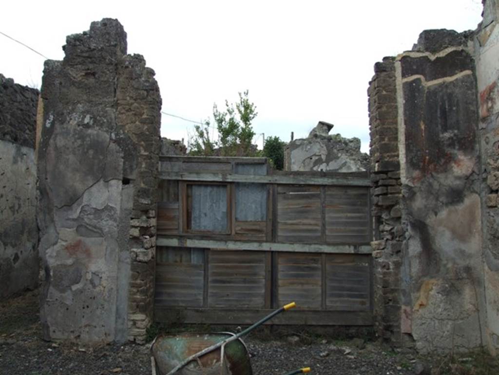 IX.2.16 Pompeii. December 2007. North-west corner of atrium with blocked door to tablinum.