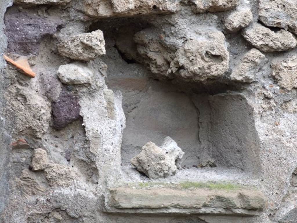 IX.2.16 Pompeii.  December 2007. Niche on north wall. Described by Boyce simply as a rectangular niche with projecting floor.
See Boyce G. K., 1937. Corpus of the Lararia of Pompeii. Rome: MAAR 14. (p.81, no: 395) 
