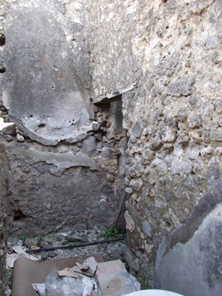 IX.2.16 Pompeii. March 2009. South west corner of small room with steps to upper floor.