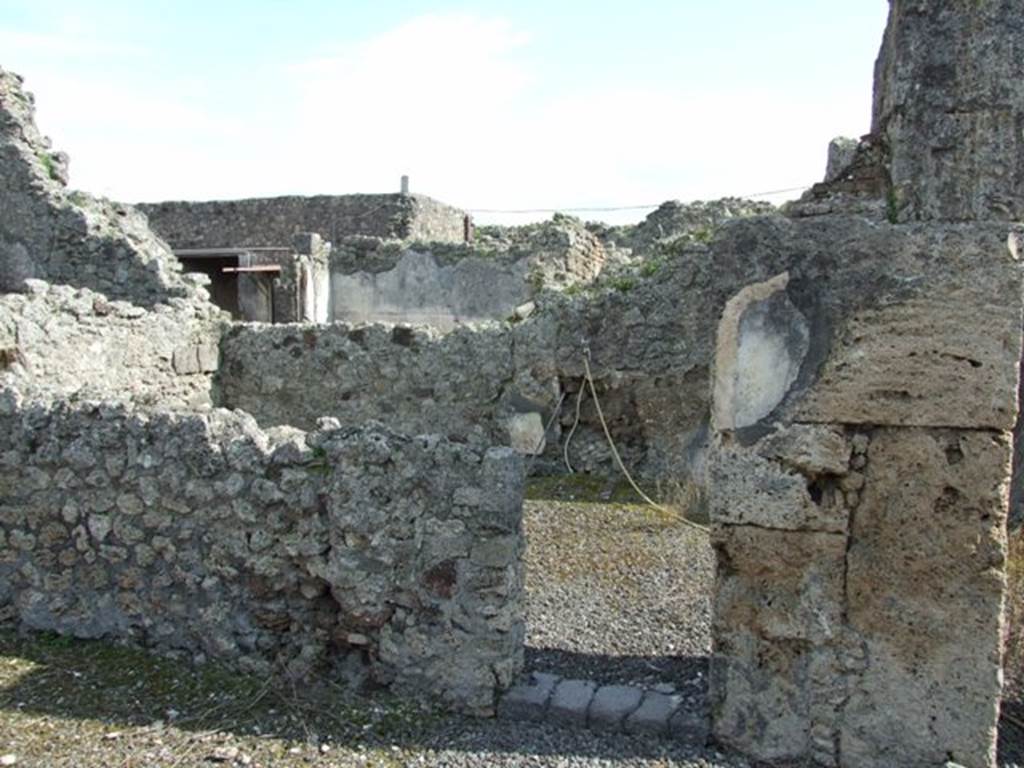 IX.2.17 Pompeii. March 2009. Room 7, Exedra. Small doorway in South wall, leading to Room 8, Triclinium.