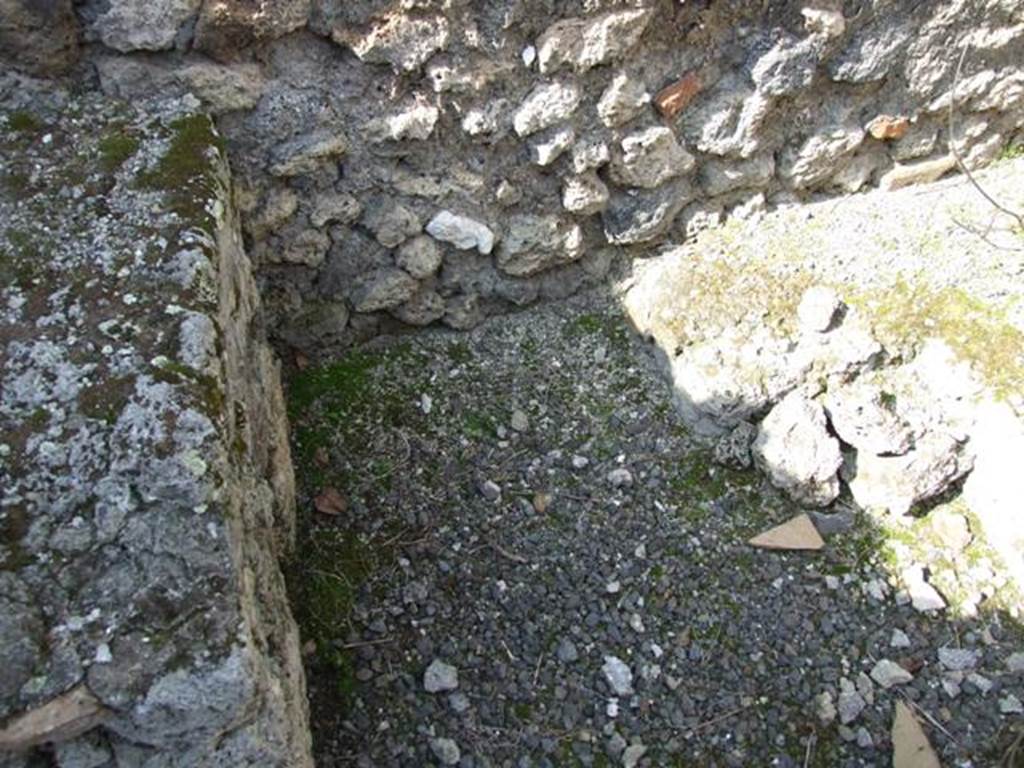 IX.2.17 Pompeii. March 2009. Room 11. Kitchen. Area between hearth and structure.