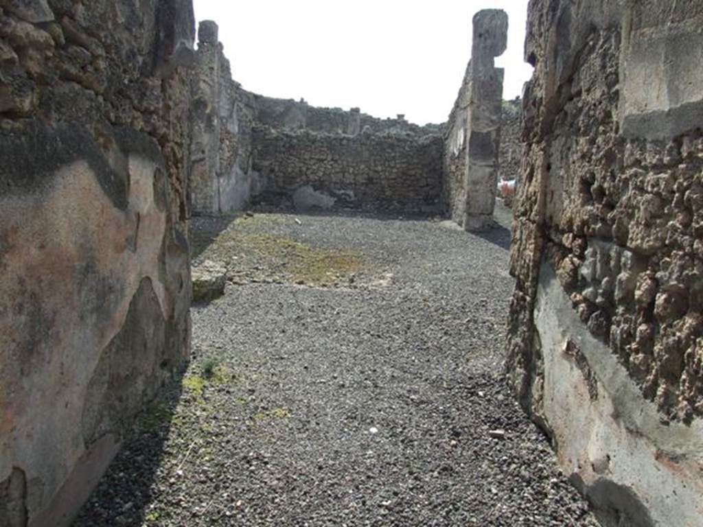 IX.2.17 Pompeii. March 2009. Looking west along entrance corridor towards room 1, atrium.
The remains of the impluvium can be seen in the centre of the atrium. According to PPP, the central floor of the atrium and impluvium were of cocciopesto. The impluvium was of cocciopesto with decoration outlined in white tesserae (a net of meanders and squares): the edge was probably moulded, but perished.
See Bragantini, de Vos, Badoni, 1986. Pitture e Pavimenti di Pompei, Parte 3. Rome: ICCD. (p.418)