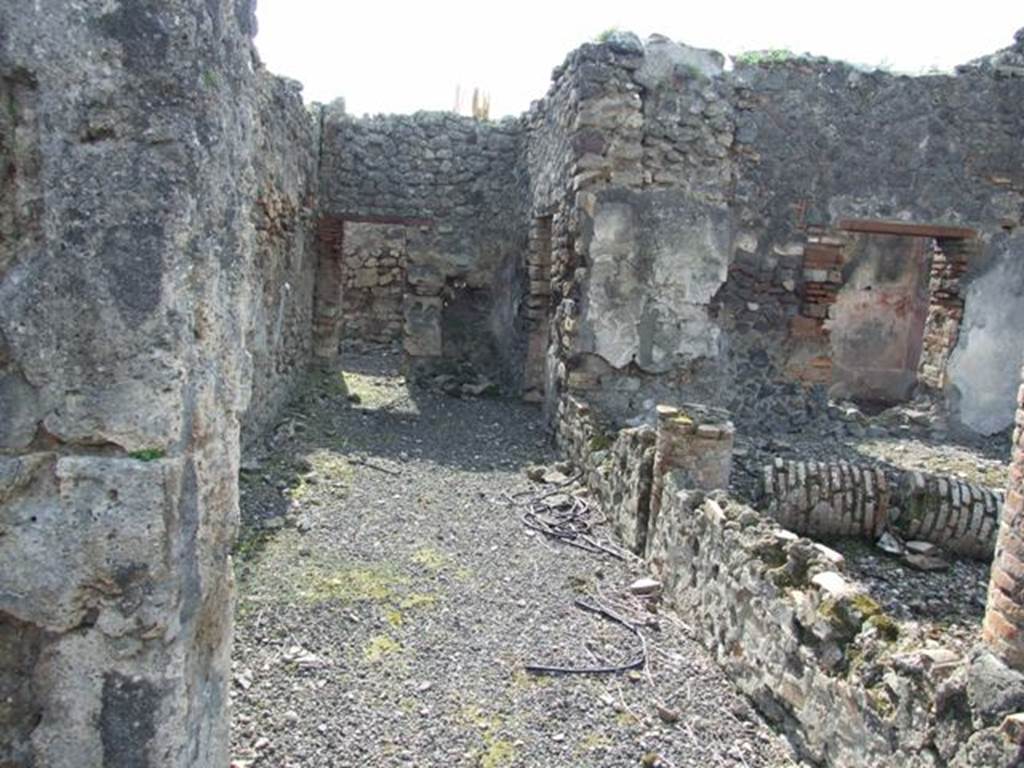 IX.2.18 Pompeii. March 2009. Room 11, garden area. Looking west along the south portico, towards kitchen area. On the right are the doorway and window of the cubiculum or triclinium, room 10.