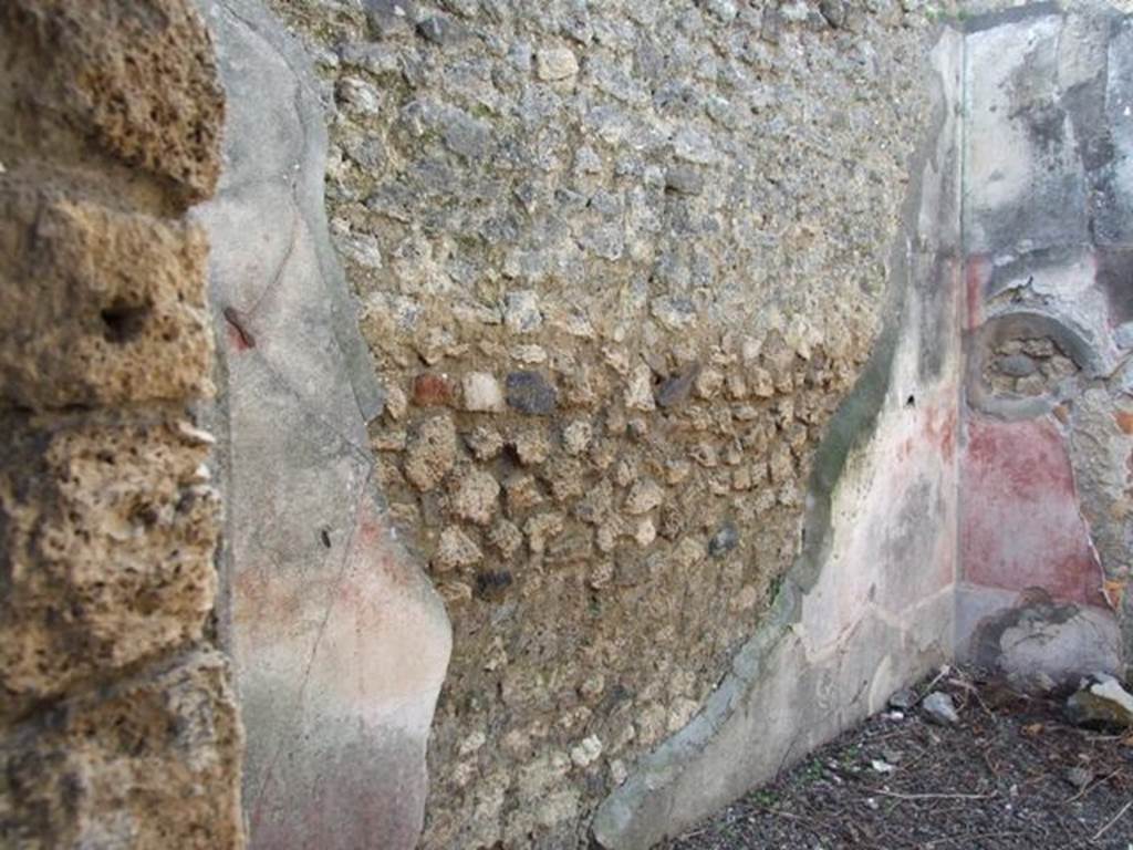 IX.2.18 Pompeii. March 2009. Room 10, west wall of triclinium. In the centre of the middle zone of the west wall would have been a painting of Galatea sitting on a dolphin.
The painting was already badly preserved at the time of its discovery, according to Sogliano, (471). Galatea, covered only around her legs by a red and blue mantle, was sitting on the back of a dolphin with her right hand on its head. In the centre of the painting, traces of the figure of Polyphemus were conserved.
See Sogliano, A., 1879. Le pitture murali campane scoverte negli anni 1867-79. Napoli: Giannini. (p.78, no. 471)