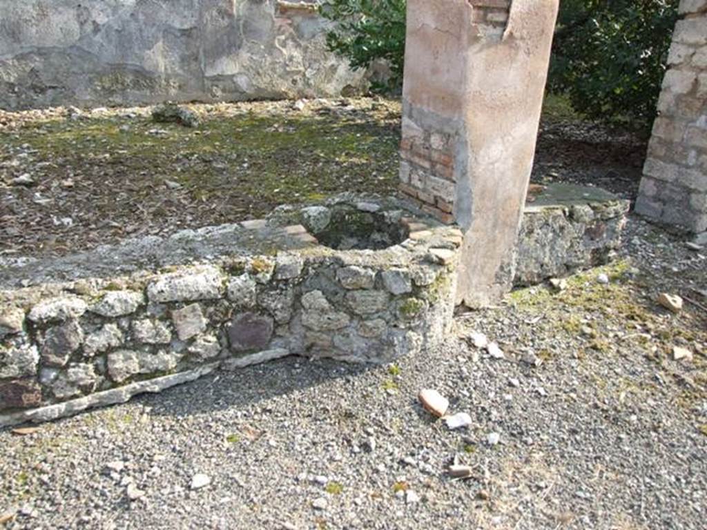 IX.2.21 Pompeii. March 2009. Room 11. Cistern opening in north wall of garden area.