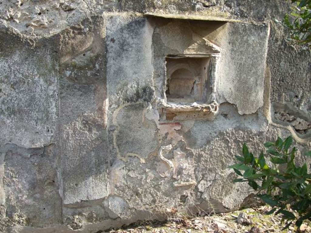 IX.2.21 Pompeii. March 2009. Room 11, aedicula shrine on south wall.
Below the shrine there were 2 serpents and an altar in stucco.
Boyce described this as a rectangular panel of white stucco, with a square niche set into it.
See Boyce G. K., 1937. Corpus of the Lararia of Pompeii. Rome: MAAR 14. (p.81-82, no. 402 and Pl.9,1).