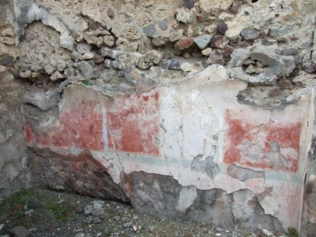 IX.2.21 Pompeii. March 2009. Room 13, north wall of cubiculum. According to Bragantini, the dado would have been red, and in the middle zone of the north wall was a white central aedicula. On both sides of it, the panels were red. The upper zone of the wall would have been white. The panel on the west end was sub-divided by a candelabra which formed the recess wall. At the base of the middle zone was an azure blue line. In the white panel, a painted female figure near an archaic herm of Dionysus, was seen.
See Sogliano, A., 1879. Le pitture murali campane scoverte negli anni 1867-79. Napoli: Giannini. (p.52, no.243)
See Bragantini, de Vos, Badoni, 1986. Pitture e Pavimenti di Pompei, Parte 3. Rome: ICCD. (p.424, cubicolo ‘m’)