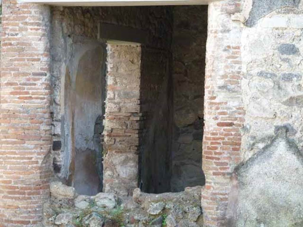 IX.2.27 Pompeii. May 2010. Looking south through north wall of triclinium on south side of garden area, looking towards south-east corner, and doorway in east wall.