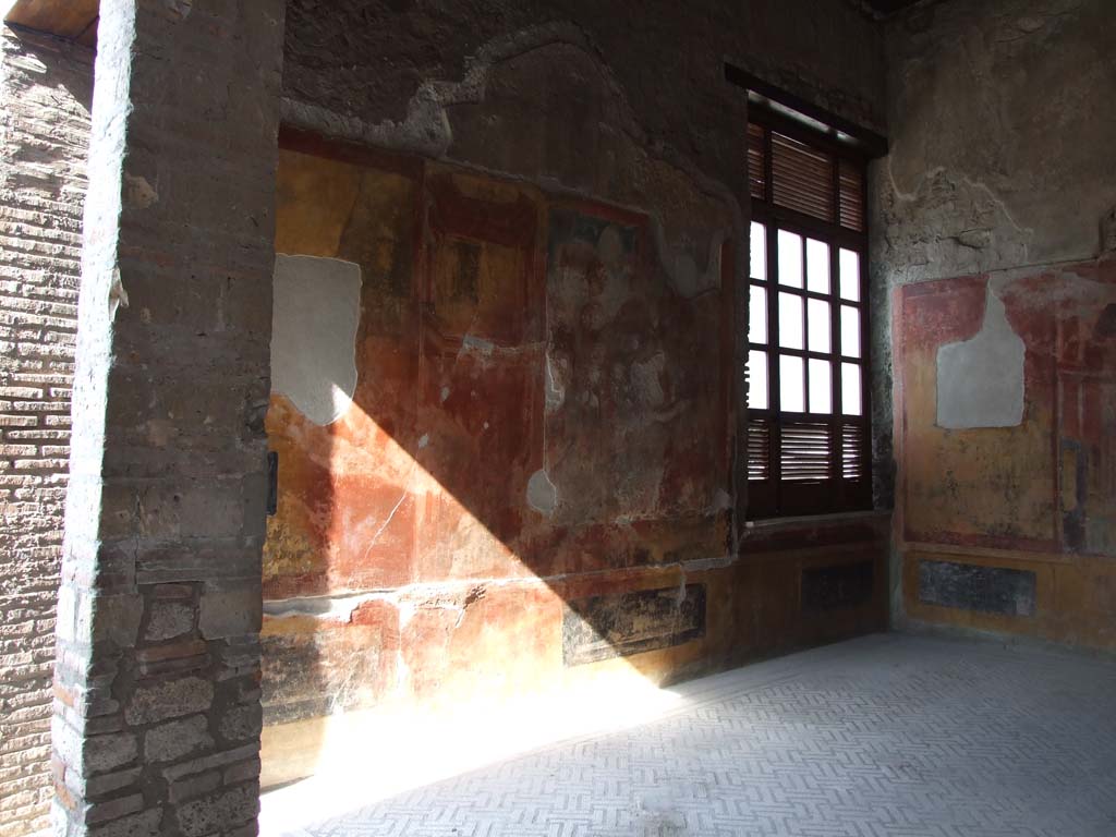 IX.3.5 Pompeii. March 2009. Room 14, north wall, with window with view over garden area.
According to Breton, the painting near a large window opening onto the xystus remained in its place.
It represented Bacchus, winner of India, erecting a trophaeon, surrounded by Bacchantes holding the thyrsus, shields and drums.
A captive with chained hands was sitting at the front.
The upper part as well as on the right-hand side have now disappeared, and one cannot see more than Bacchus and one of his followers.
See Breton, Ernest. 1870. Pompeia, Guide de visite a Pompei, 3rd ed. Paris, Guerin.
