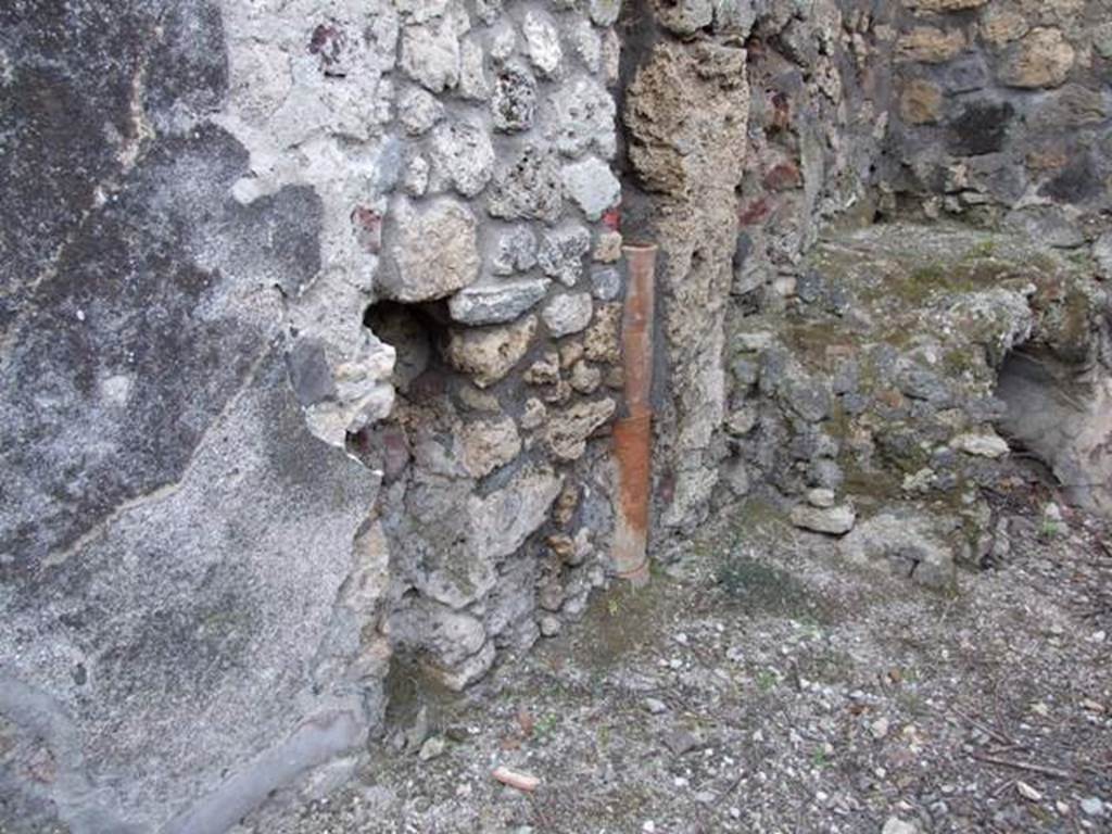 IX.3.15 Pompeii. March 2009. Room 12. West wall in north west corner of portico.