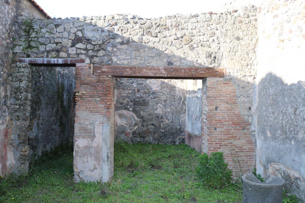 IX.3.19 Pompeii. December 2018.
Looking north across shop-room of bakery, the corridor to the bakery is on the left. Photo courtesy of Aude Durand.