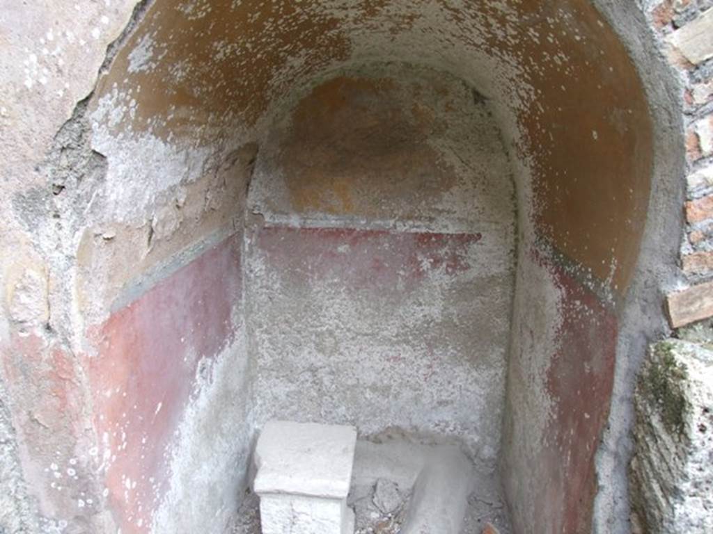 IX.3.20 Pompeii. December 2007. Room 8, arched recess under staircase.
According to Fiorelli, found fixed in the arch under the stairs was a small marble disc with the relief of a tragic mask, removed from another site and put here as an charm against bad luck.
See Pappalardo, U., 2001. La Descrizione di Pompei per Giuseppe Fiorelli (1875). Napoli: Massa Editore. (p.147)