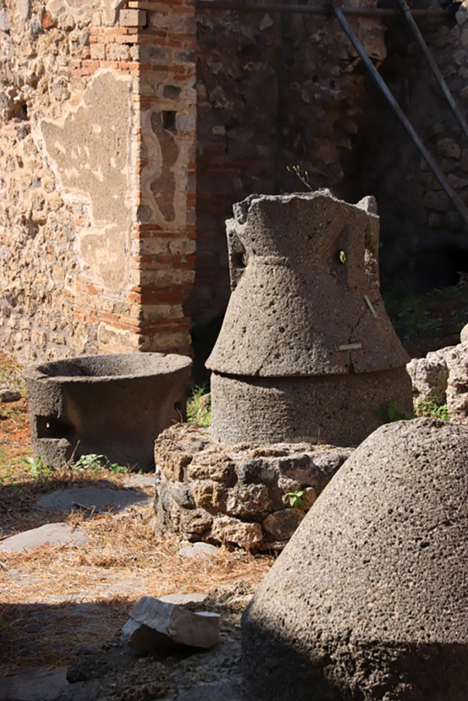 IX.3.20 Pompeii. Pompeii. October 2022. Detail of mills from bakery room. Photo courtesy of Klaus Heese.
