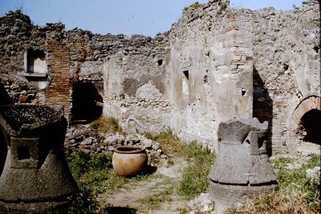 IX.3.20 Pompeii. 1964. Room 1, mills in bakery. Photo by Stanley A. Jashemski.
Source: The Wilhelmina and Stanley A. Jashemski archive in the University of Maryland Library, Special Collections (See collection page) and made available under the Creative Commons Attribution-Non Commercial License v.4. See Licence and use details.
J64f1597