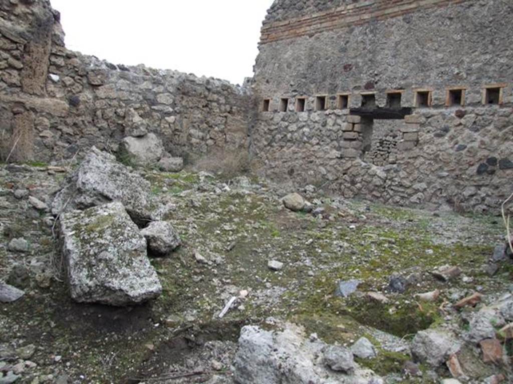 IX.3.20 Pompeii. December 2007. Room 2, stables. In the east wall, the holes for the support beams of an upper floor/mezzanine can be seen.