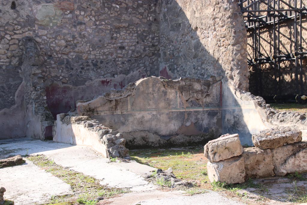 IX.3.22 Pompeii. October 2022.
Looking towards room with black painted wall decorations towards north-west corner. Photo courtesy of Klaus Heese.