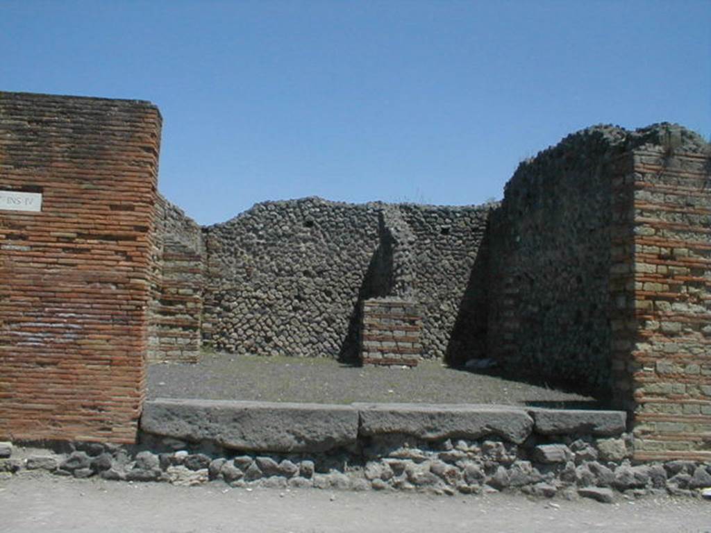 IX.4.1 Pompeii. May 2005. Entrance, looking east from Via Stabiana, towards rear rooms.
According to Maiuri, three of the shops on the corner of this insula, appear to have had an elevated threshold of at least 0.80m above the floor of the sidewalk and what should have been the original threshold. They clearly distinguish the brickwork/masonry of the above elevation from the original floor of the threshold. In the third taberna (from the corner of the quadrivium) IX.4.3, only one block of the threshold appears located in its place.
See Maiuri, A, (2002): L’ultima fase edilizia di Pompei, Arte Tipografica, Naples, (p.75, note 3).
.
